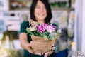 Woman hand holding beautiful flower in sack bag,Happy and smiling,Selective focus,Close up Royalty Free Stock Photo