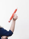 Woman holding big pencil Royalty Free Stock Photo