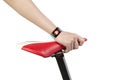 Woman hand holding bike seat wearing health sensor smart watch