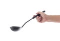 Woman hand holding black ladle dipper isolated