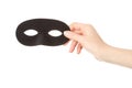 Woman hand holding black mask Royalty Free Stock Photo