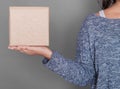 Woman holding blank carton box. Mockup for design Royalty Free Stock Photo