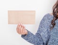 Woman holding blank paper envelope. Mockup for design Royalty Free Stock Photo