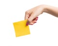 Woman hand holding blank yellow notepaper Royalty Free Stock Photo