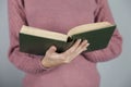 Woman hand holding book