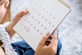 Woman hand holding calendar planning for due date payment, tax ,pay day concept Royalty Free Stock Photo