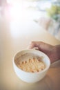 Woman hand holding coffee cup caramel macchiato hot Royalty Free Stock Photo