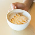 Woman hand holding coffee cup caramel macchiato hot Royalty Free Stock Photo