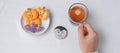 woman hand holding coffee cup during eating funny Halloween Cookies. Happy Halloween day, Trick or Threat, Hello October, fall Royalty Free Stock Photo