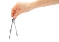 Woman hand holding compass for drawing. Royalty Free Stock Photo