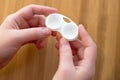 Woman hand is holding contact lens case Royalty Free Stock Photo
