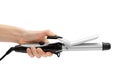 Woman hand holding curling iron tool. Royalty Free Stock Photo