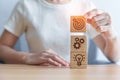 Woman hand holding dartboard above Gear and Lightbulb icon block. business planning process, goal, strategy, target, mission, Royalty Free Stock Photo