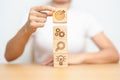 Woman hand holding dartboard above Gear, magnifying and Lightbulb icon block. business planning process, goal, strategy, target, Royalty Free Stock Photo