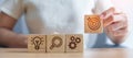 Woman hand holding dartboard above Gear, magnifying and Lightbulb icon block. business planning process, goal, strategy, target, Royalty Free Stock Photo