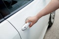 Woman hand holding door car to unlock or lock Royalty Free Stock Photo