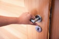 Woman Hand is Holding Door Knob While Opening a Door in Bedroom, Lock Security System and Access Safety of Doorway., Interior Royalty Free Stock Photo