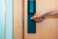 Woman hand is holding door knob to opening the door Royalty Free Stock Photo