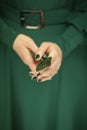 Woman hand holding exotic butterfly wing, sensual studio shot Royalty Free Stock Photo