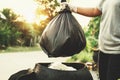 woman hand holding garbage bag for recycle