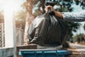 woman hand holding garbage bag put in to trash Royalty Free Stock Photo
