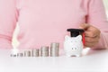 Woman hand holding graduation cap with money coin