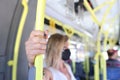 Woman hand holding handrail in tram or bus Royalty Free Stock Photo