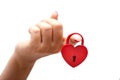 Woman hand holding heart shaped lock Royalty Free Stock Photo