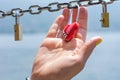 Woman hand holding heart shaped padlock Royalty Free Stock Photo