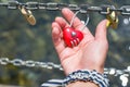 Woman hand holding heart shaped padlock Royalty Free Stock Photo