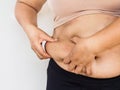 Woman hand holding her own belly fat. woman diet lifestyle to re Royalty Free Stock Photo