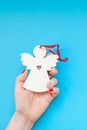 Woman hand holding homemade wooden christmas toy Royalty Free Stock Photo