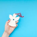 Woman hand holding homemade wooden christmas toy Royalty Free Stock Photo