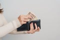 Woman hand holding Japanese Yen banknote with wallet. Thousand Yen money. Japan cash, Tax, Recession Economy, Inflation, Royalty Free Stock Photo