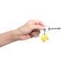 Woman hand holding key with house shape key ring Royalty Free Stock Photo