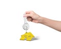 Woman hand holding key with house shape keyring