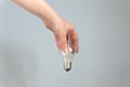 Woman hand holding light bulb. Idea and busines concept Royalty Free Stock Photo