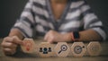 Woman hand holding lightbulb above dartboard, Gear, and magnifying icon block. thinking, business planning process, goal, strategy Royalty Free Stock Photo