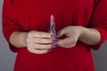 Woman hand Lipstick