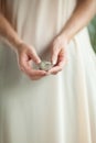 Woman hand holding little fossile ammonite, sensual studio shot with soft light