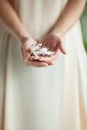 Woman hand holding little sea shell, sensual studio shot with soft light Royalty Free Stock Photo