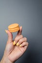 Woman hand holding a macaron