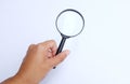 Woman hand holding  Magnifying glass  isolate on a white background Royalty Free Stock Photo