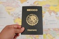 Woman hand holding a mexican passport