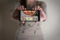 Woman hand holding mobile with order food online. Royalty Free Stock Photo