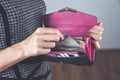Woman hand holding money with wallet Royalty Free Stock Photo
