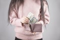 woman hand holding money with wallet Royalty Free Stock Photo