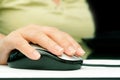 Woman hand holding mouse Royalty Free Stock Photo