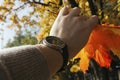 Woman hand holding orange maple leaves Royalty Free Stock Photo