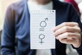 Woman hand holding Paper note with equal sign between Male and Female symbol. gender equality, International Women day and Human Royalty Free Stock Photo